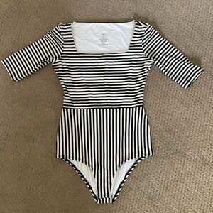 Black and white one piece bathing suit, sleeves